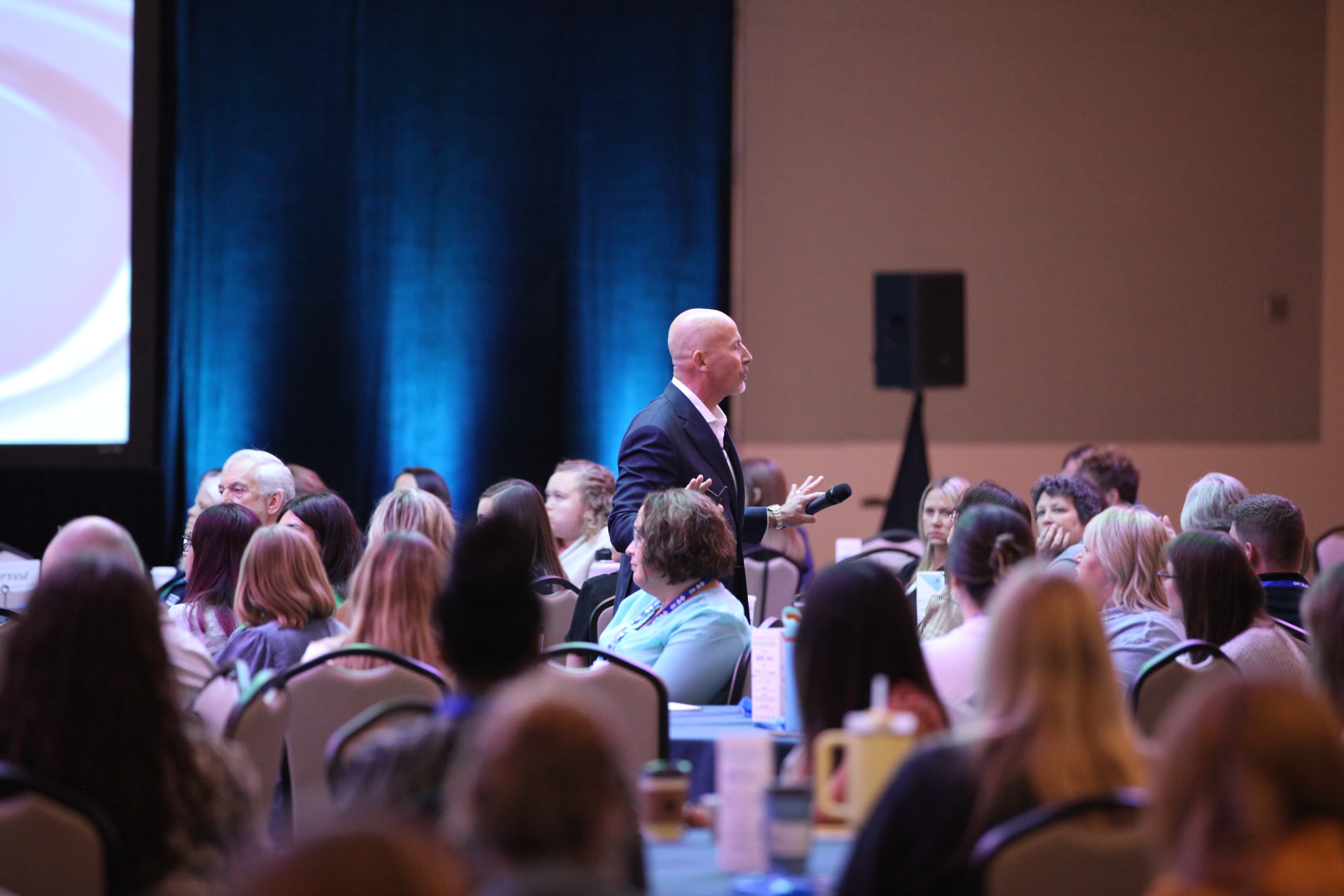 Steve Lowisz speaking with conviction to a packed conference room