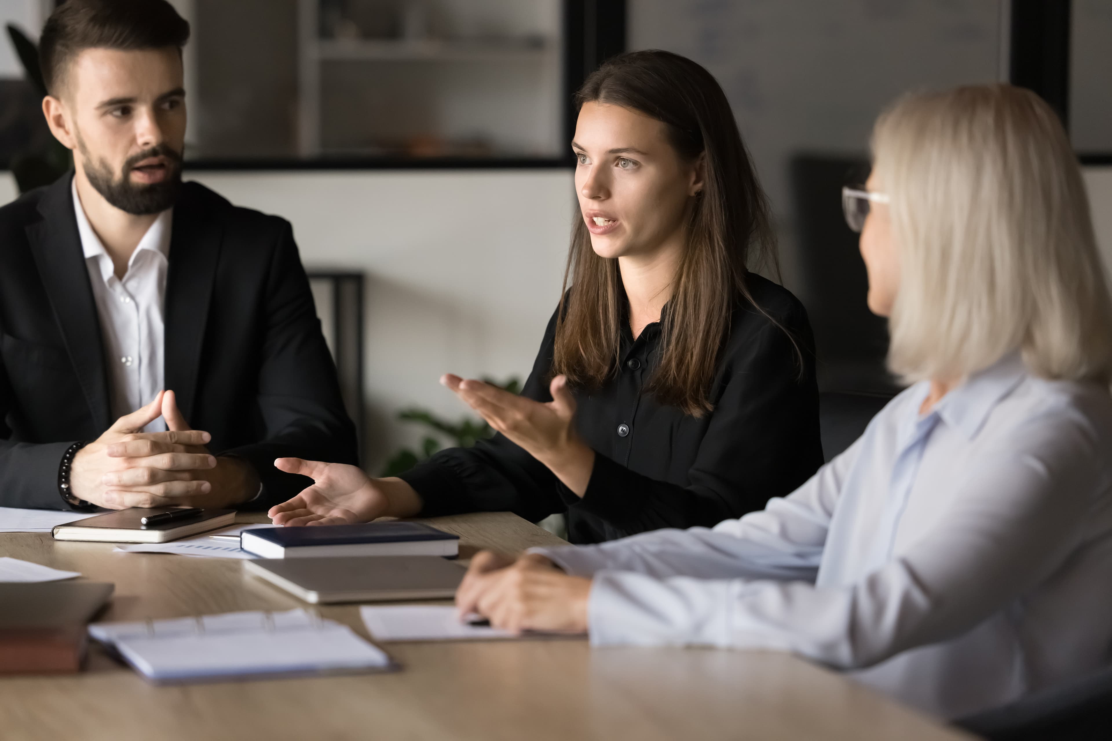 Senior leadership team in a focused boardroom conversation